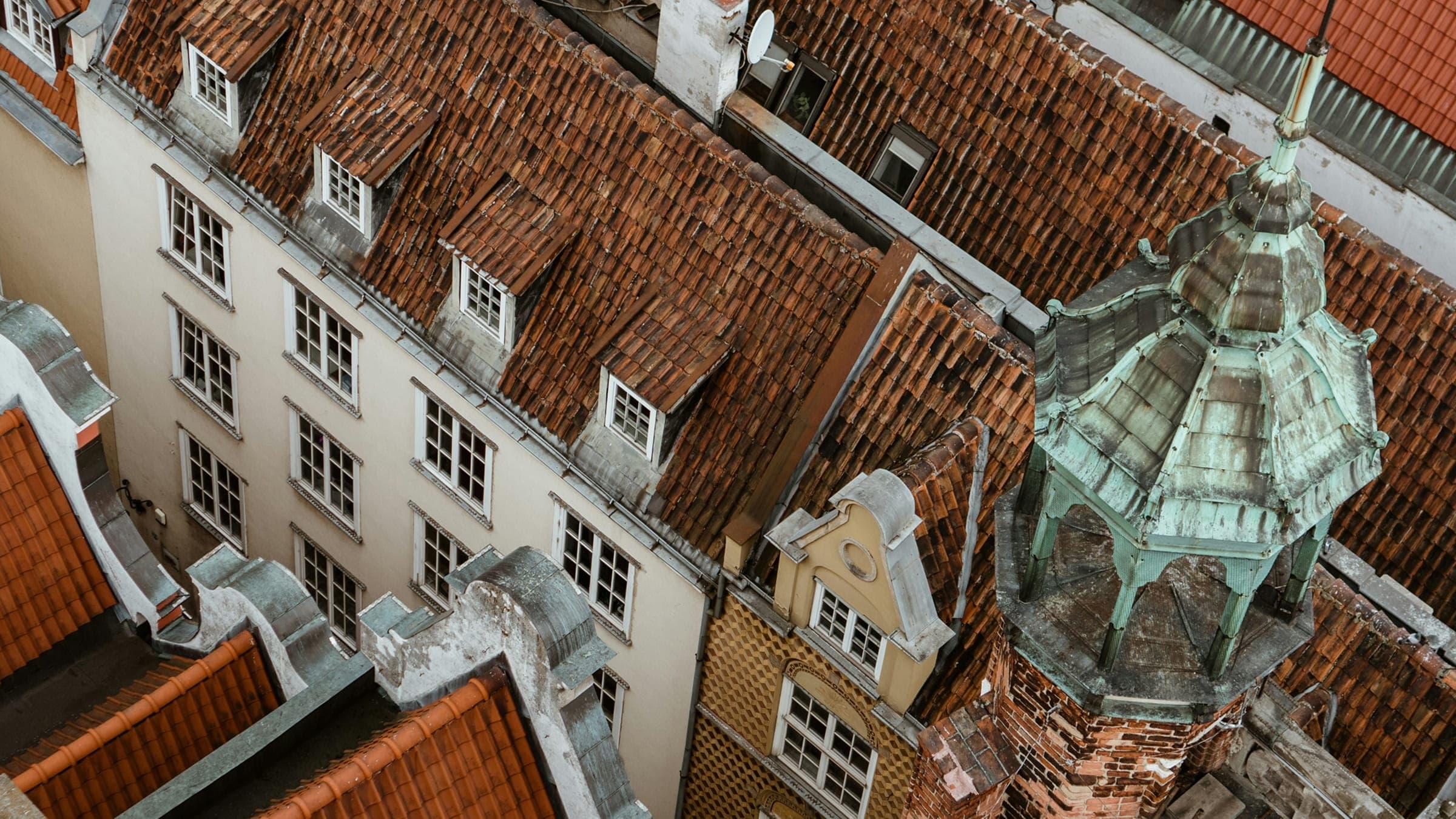 Rooftop view of a historic European city district.