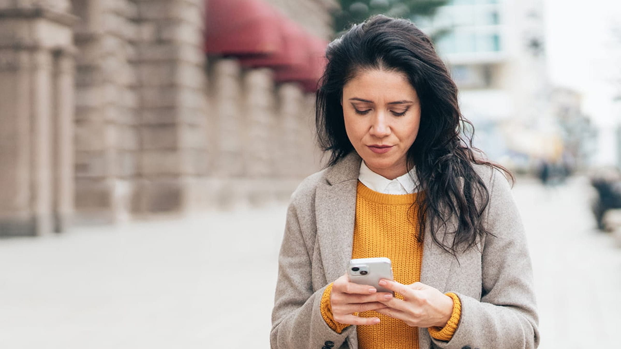 Person using a mobile phone to manage their banking.