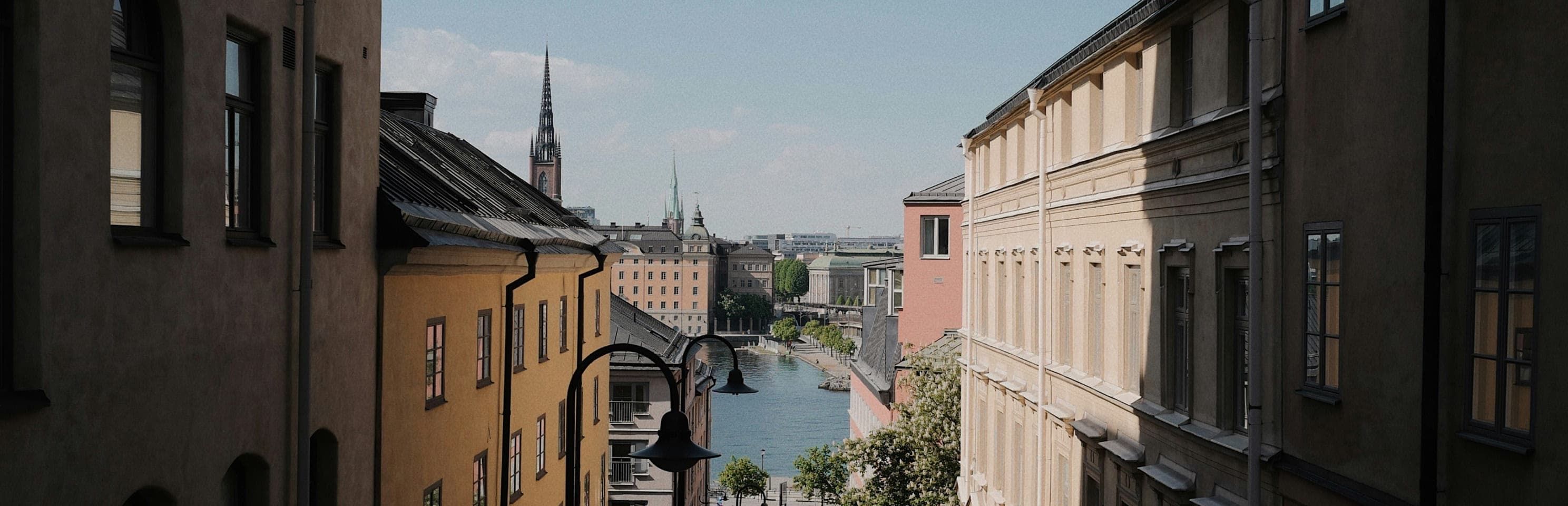 City view featuring a canal and classical architecture.